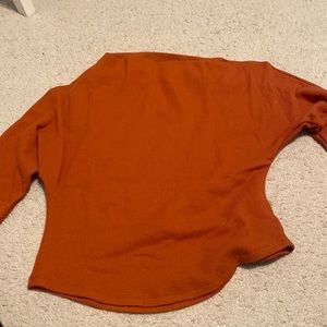 Orange sweater. "Fuji thermal" from Free People. We The Free brand.